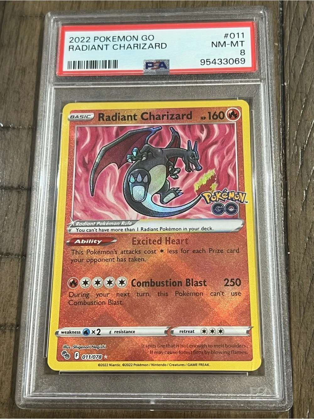 Radiant Charizard Pokémon GO Holo Card - PSA 8